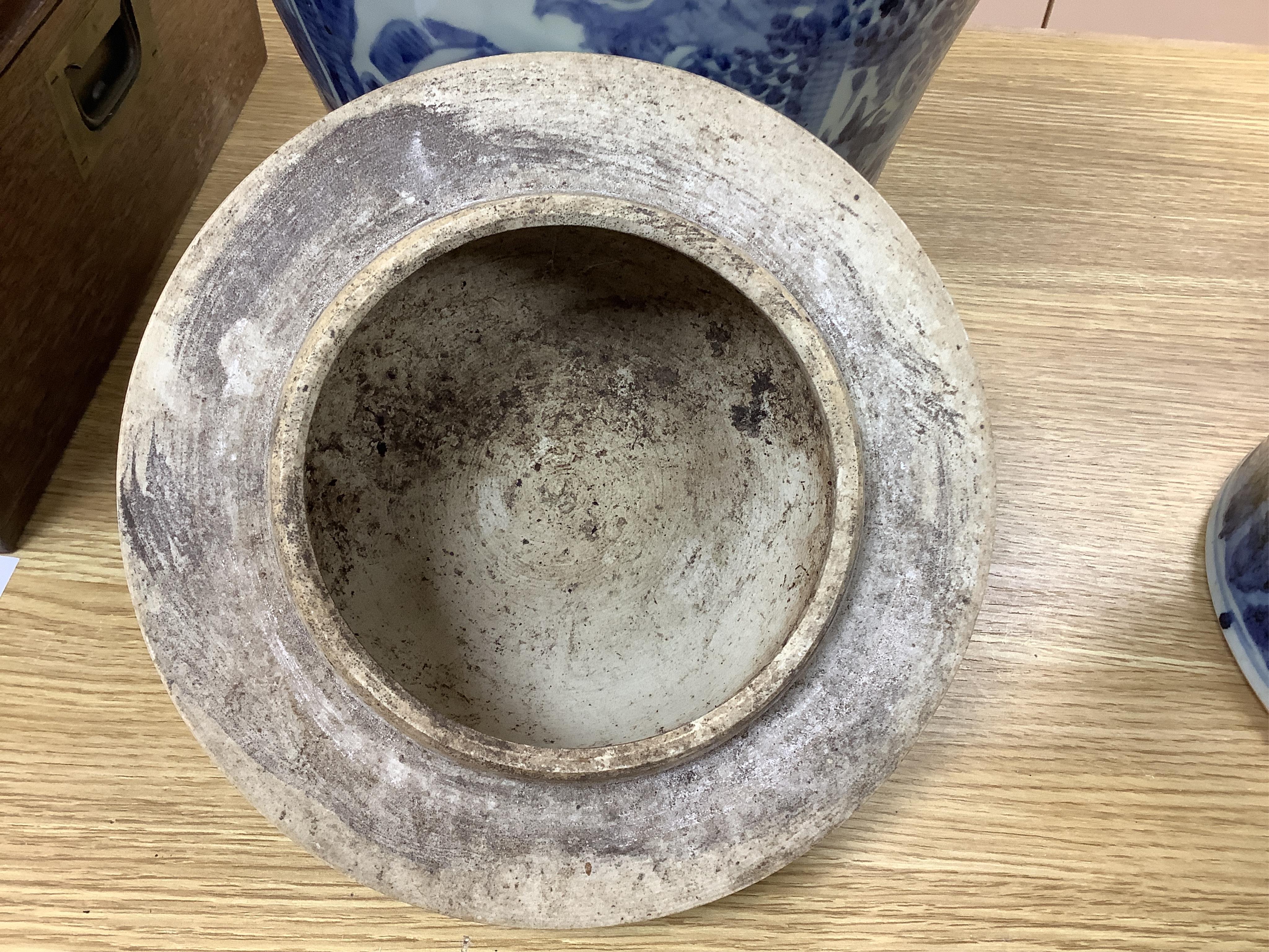 A pair of large Chinese blue and white ginger jars and covers, 54cm high. Condition - fair to good